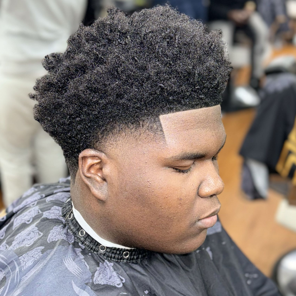 Tapered afro with clean lineup — House Of Skillz Barbers Brooklyn